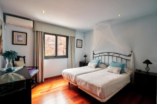 Ένα ή περισσότερα κρεβάτια σε δωμάτιο στο Villas Anais