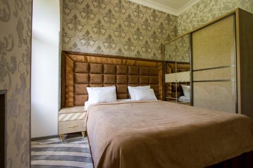 Postel nebo postele na pokoji v ubytování Jermuk Moscow Health Resort