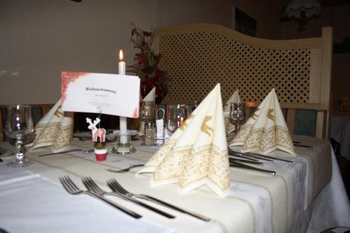 a table with a candle on top of a table at Berghotel Schlemmer in Bressanone