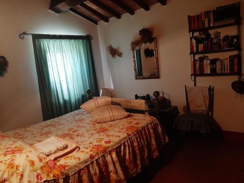 מיטה או מיטות בחדר ב-Poggio Bicchieri