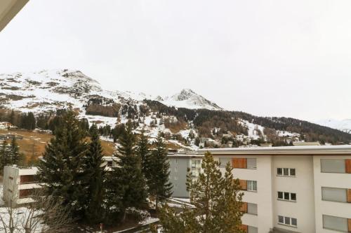 a view of a snowy mountain from a building at Casa Bünda in Davos