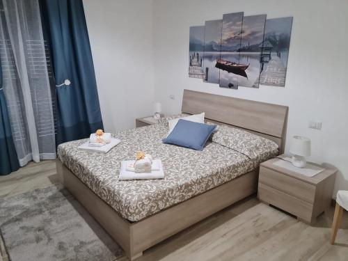 a bedroom with a bed with two teddy bears on it at B&B Villa Chiara - Bed And Breakfast in Taormina