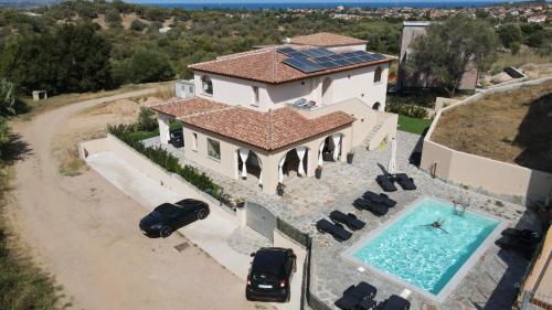an aerial view of a house with a swimming pool at MOLAROTTO CAMERE CON ANGOLO COTTURA in San Teodoro