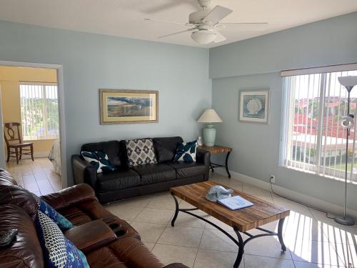 a living room with a couch and a coffee table at Island House Beach Resort 16N in Siesta Key