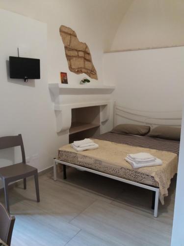 Postel nebo postele na pokoji v ubytování TORRE SUL MARE affittacamere Ugento