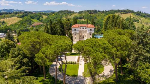an aerial view of a mansion in the trees at Villa Monty Banks in Cesena