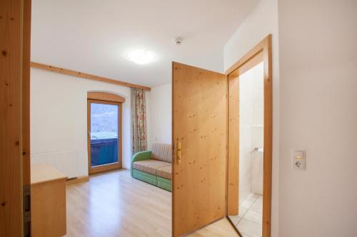 an open door to a room with a couch at Hotel Kammerhof in Mariastein