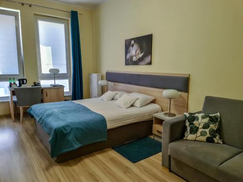 Postel nebo postele na pokoji v ubytování Antonińska Hotel & Apartamenty