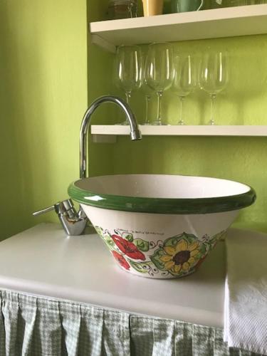 a kitchen sink with a faucet on a counter at La Vite è Bella in Govone