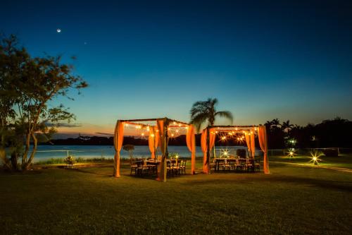 an outdoor wedding with lights and a marquee at Fiesta Inn Tampico in Tampico