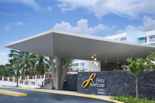 a building with a first marriott sign in front of it at Fiesta Americana Cozumel All Inclusive in Cozumel