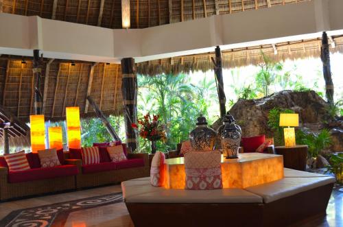 a lobby with couches and a table in a building at Fiesta Americana Puerto Vallarta All Inclusive & Spa in Puerto Vallarta