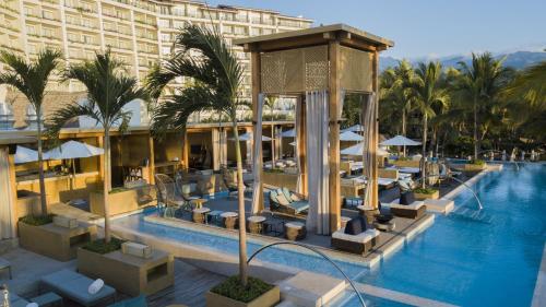 a resort with a swimming pool and a hotel at Fiesta Americana Puerto Vallarta All Inclusive & Spa in Puerto Vallarta