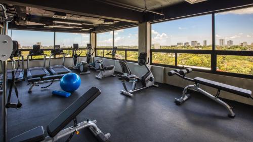 a gym with a view of the city at Mex Hoteles in Cancún