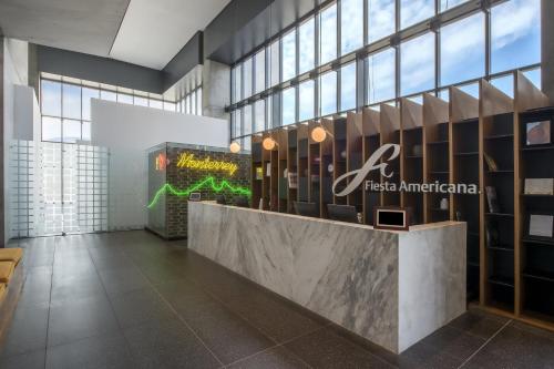 a lobby of a hotel with a reception desk at Fiesta Americana Monterrey Pabellón M. in Monterrey