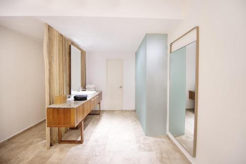 a bathroom with a sink and a mirror at The Explorean Cozumel All Inclusive in Cozumel