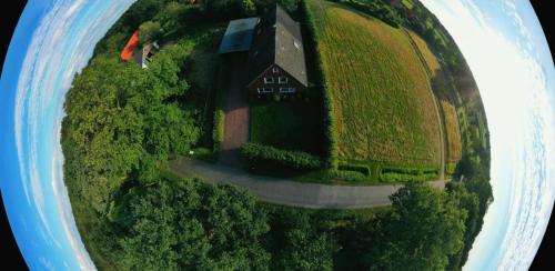 an aerial view of a house and a road at Ediths Haus in Rhauderfehn