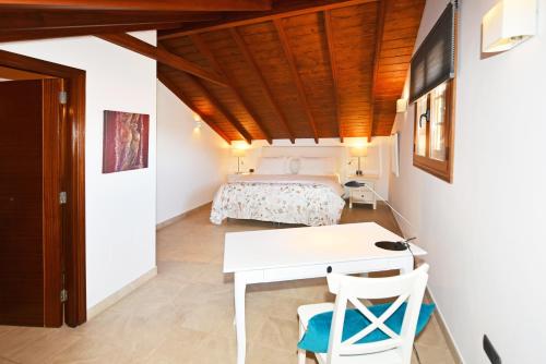 Posteľ alebo postele v izbe v ubytovaní Apartamentos La Casa Verde