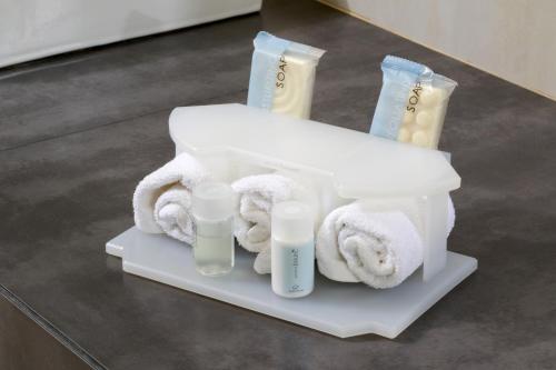 a container with towels and other products on a table at Holiday Inn Express Mexico Aeropuerto by IHG in Mexico City