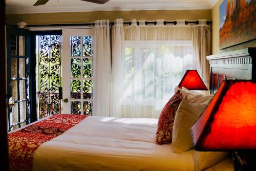 a bedroom with a large bed and a window at Lantern Light Inn - Romantic Getaway in Sedona