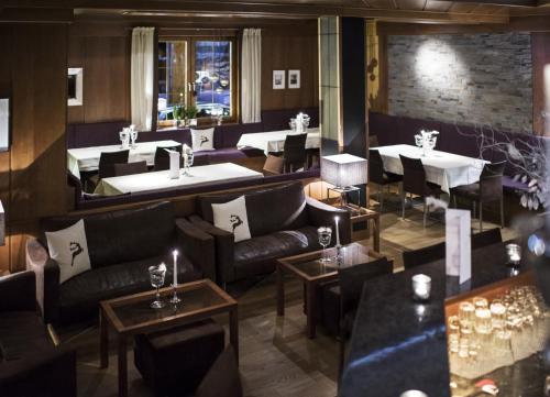 Un lugar para sentarse en Alpines Gourmet Hotel Montanara