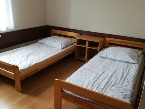 En eller flere senge i et værelse på Osrodek Wczasowy Słonko