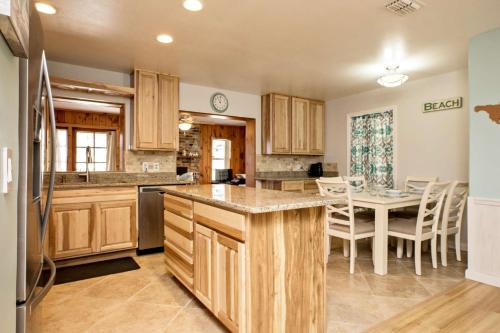 a kitchen with wooden cabinets and a table with chairs at 1050 Tompkins Drive in Port Orange