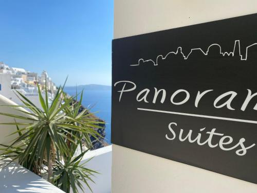 a sign for a restaurant on the side of a building at Panorama Suites in Fira