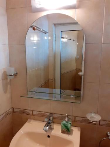 a bathroom with a sink and a mirror at Amour bleu - Синя Лю-Бо-В in Sinemorets