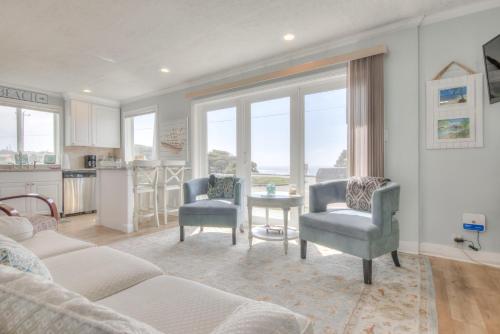a living room with a couch and two chairs and a table at Ohana Shores in Lincoln City