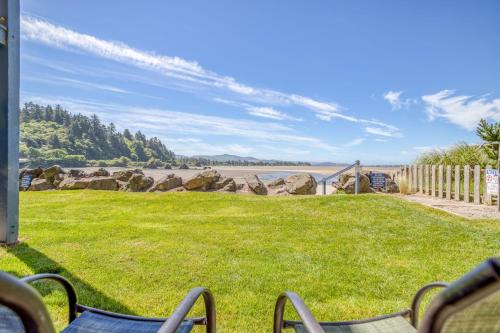 a yard with chairs and a view of the water at Dock of the Bay 108 in Lincoln City