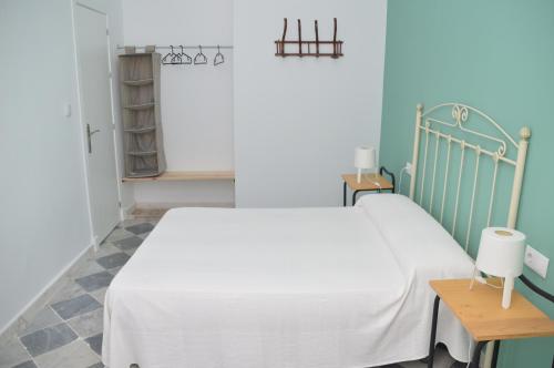 Letto o letti in una camera di Pensión Las Cuatro Naciones