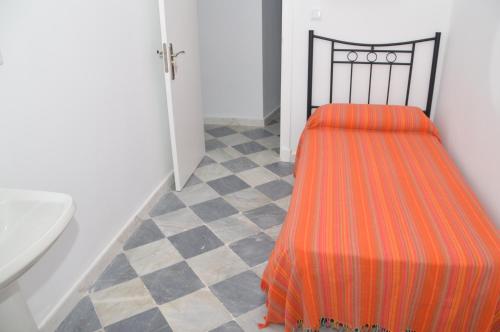Letto o letti in una camera di Pensión Las Cuatro Naciones