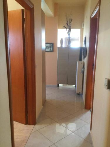 a hallway of a house with a refrigerator in it at Cosy Country Villa in Pappayiannádhes