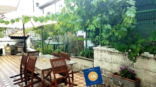 a patio with a table and chairs and a grill at Casa San Francesco in Agnone