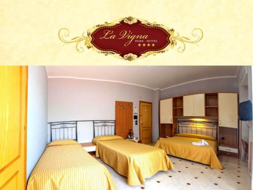 a hotel room with two beds and a sign on the wall at La Vigna Hotel in Bonea