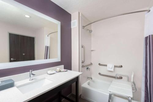 a bathroom with a sink and a tub and a mirror at La Quinta by Wyndham Kanab in Kanab