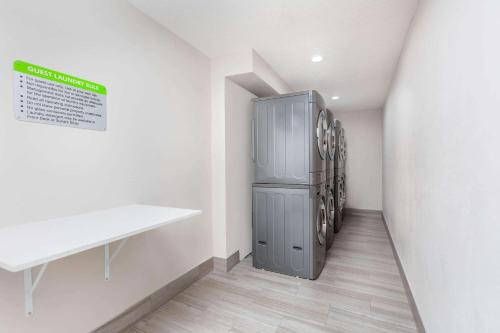 a laundry room with a refrigerator in the wall at La Quinta by Wyndham Kanab in Kanab