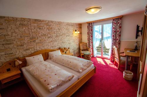 Postel nebo postele na pokoji v ubytování Hotel Blumental