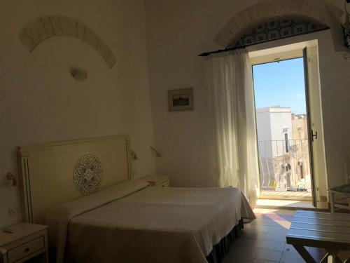 Gulta vai gultas numurā naktsmītnē Rocca Sul Mare Hotel