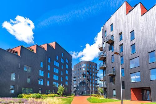 two tall buildings next to each other at Artisa Riia Str 22A Luxury apartment in Tartu