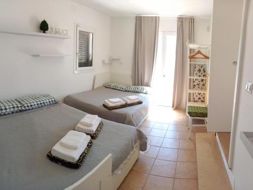 En eller flere senge i et værelse på Trullo Il Noce..Holiday home