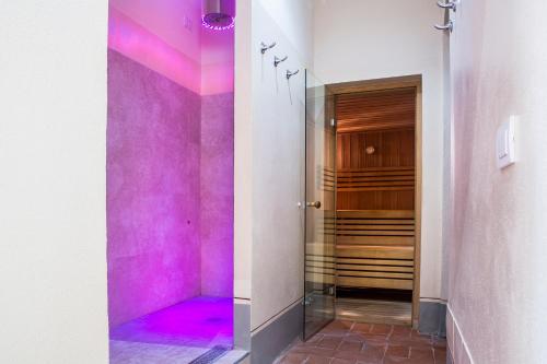 a bathroom with a tub and a shower stall at Borgo Scopeto Wine & Country Relais in Vagliagli