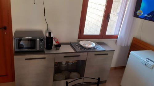 Η κουζίνα ή μικρή κουζίνα στο Casa Arega Funtana Meiga fronte spiaggia