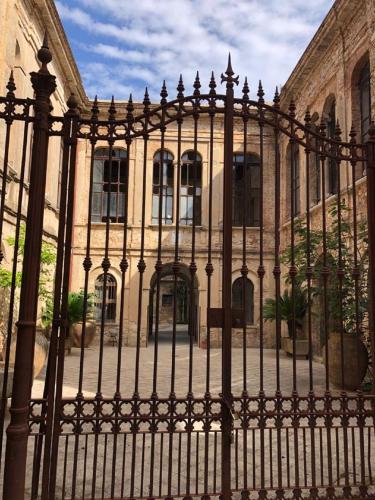 an iron fence in front of a building at Santa Caterina dello Ionio Boutique Apartments in Santa Caterina dello Ionio