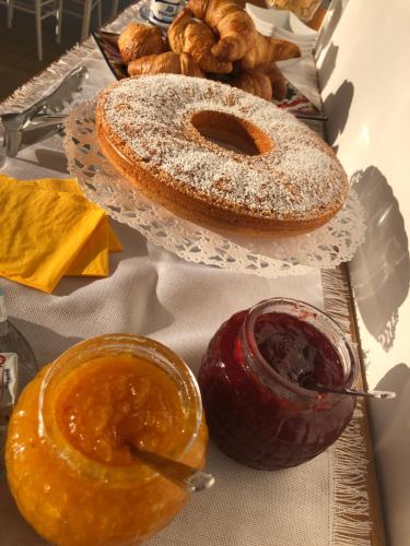 a table with two plates of pastries and other foods at COCCIU D’AMURI in Castellammare del Golfo