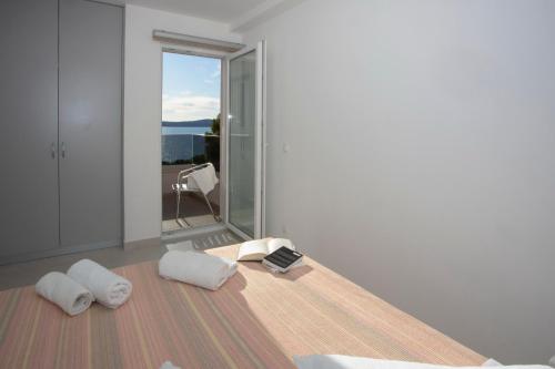 a room with two white pillows on the floor at Apartments Medvidovic in Baška Voda