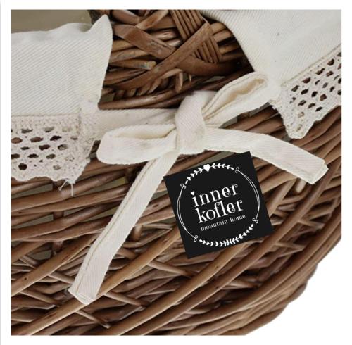 a basket with a tag on top of it at Appartements Innerkofler Mountain Home in San Candido