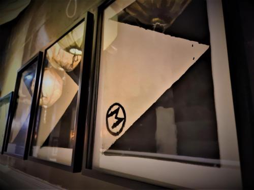 a window with a sticker on it with food at M Boutique Hotel Station 18 - Ipoh in Ipoh