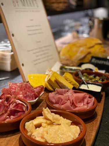 a bunch of different types of food on a table at Hotel CENTRAL Bar & Restaurant in Gerlos